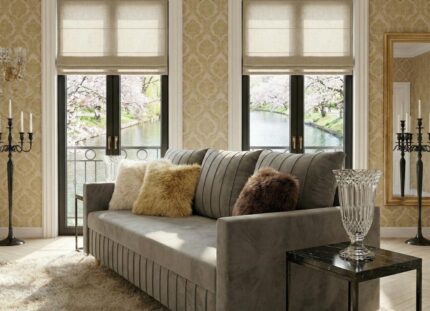 Ujęcie bokiem w eleganckim salonie szara sofa rozkładana 224 cm Watson